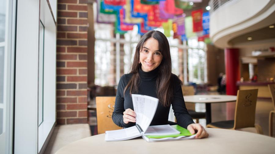 Student studying their notes in the Morgan University Center